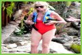 Goldie Hawn Rocks a Red Swimsuit at Age 67, Feeds Dolphins With Kurt Russell